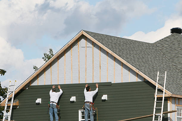 Professional Storm Damage Siding Repair technician working in Gilbert, MN